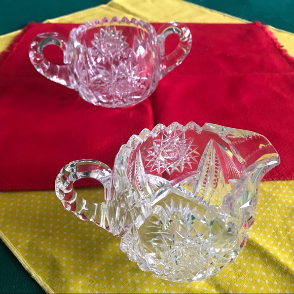 Antique glass sugar bowl and creamer set is MCM & American Brilliant in design